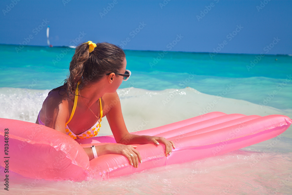 Wall mural girl enjoying the waves