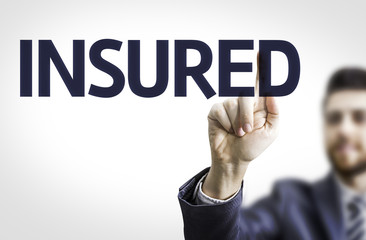 Business man pointing to transparent board with text: Insured