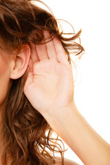 Part of head woman with hand to ear listening