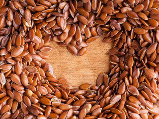 Healthy diet. Flax seeds linseed border on wooden background