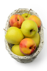 Apples and nectarines in a basket