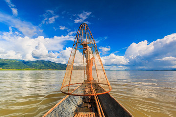 Fototapeta na wymiar Traditional fisherman catching fish at Inle lake, Myanmar