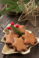 Gingerbread cookie and Christmas decorations on a table