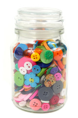 Colorful Haberdashery buttons in a glass jar. Vertical on White