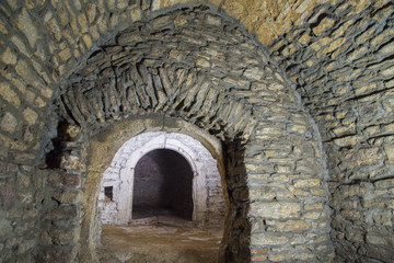 Fototapeta na wymiar Abandoned medieval cellar