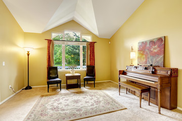 Bright living room with antique piano