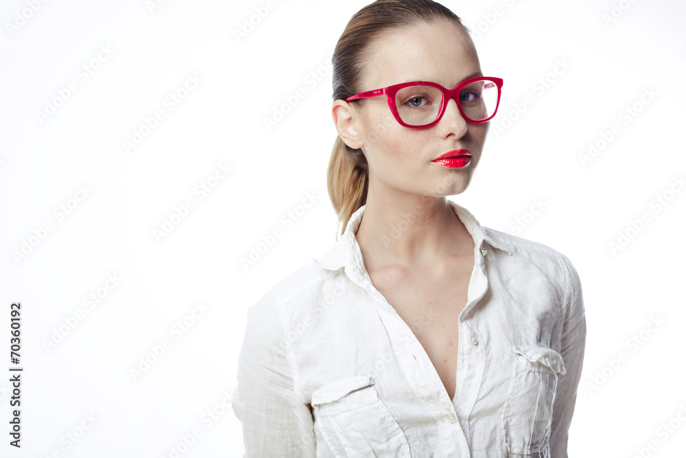 Wall mural business woman in glasses and a bright white shirt on a white ba