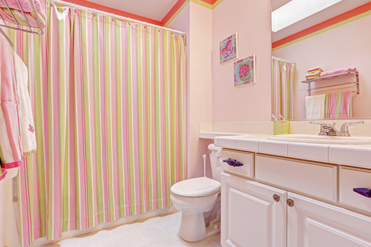 Girls bathroom interior in pink tones