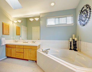 Fototapeta na wymiar Refreshing bathroom interior in light blue tone