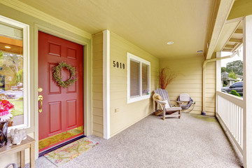 Spacious entrance porch with red door