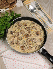 Fried mushrooms in a creamy sauce