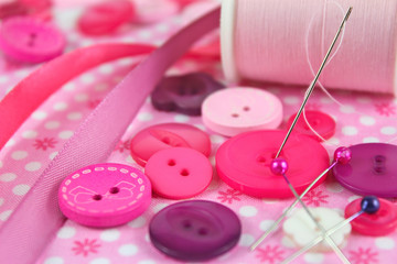 pink scene of sewing, haberdashery items.