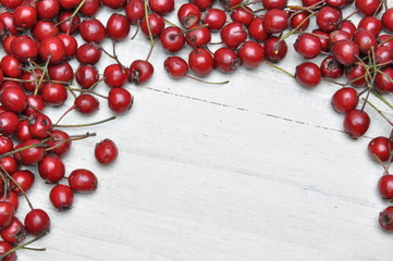 Hawthorn berries on wooden table