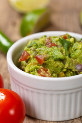 Guacamole with avocado, lime, tomato and cilantro