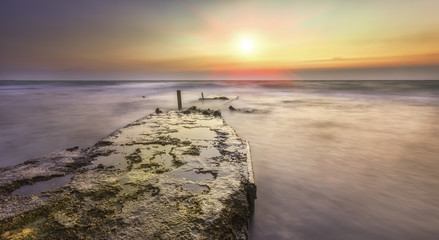 old razrusheny berth lonely protrudes the distance to the horizo