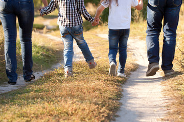 Obraz premium Family feet and legs in jeans.