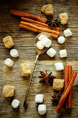 Fototapeta na wymiar marshmallow with cinnamon, star anise and cane sugar