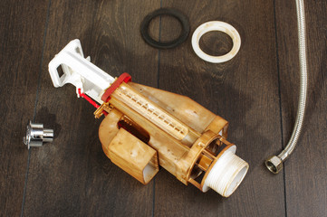 Plumber work repairing loo mechanism