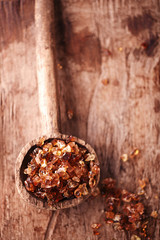 Gum arabic, also known as acacia gum - in  old wooden spoon