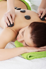 Obraz na płótnie Canvas Girl on a stone therapy, hot stone massage
