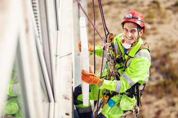 Industrial climber on a building during winterization works