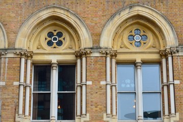 Fototapeta na wymiar Arched victorian brick windows
