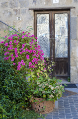 Door in old stone house, , Italy
