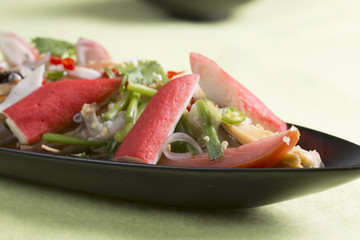 Thai spicy seafood salad on the plate