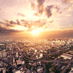 Fototapeta premium bird view of urban cityscape at sunset