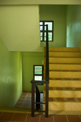 Modern stairs with wooden handrail