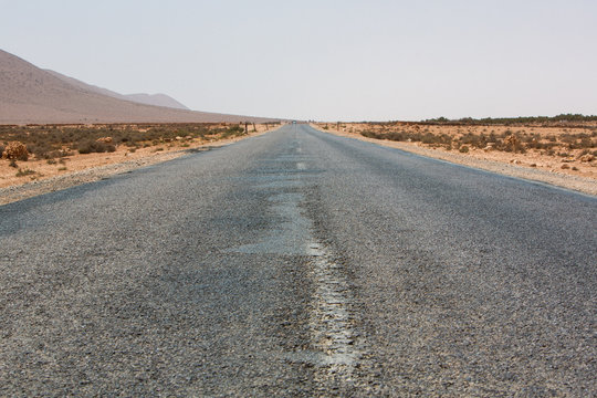 Straight road through the desert in Morocco, Africa