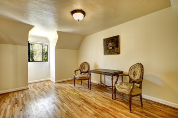 Empty room in old house with antique carved wood furniture