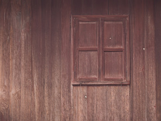 window in the wall of an old wooden house