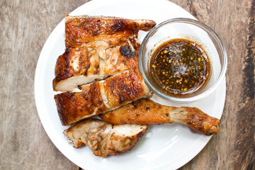 Grilled chicken on plate.