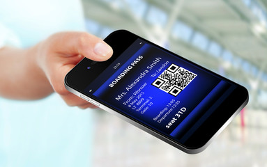 hand holding mobile phone with mobile boarding pass on airport - obrazy, fototapety, plakaty