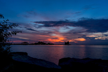 Fototapeta na wymiar Koh Loi Sriracha silhouette with sunset sky