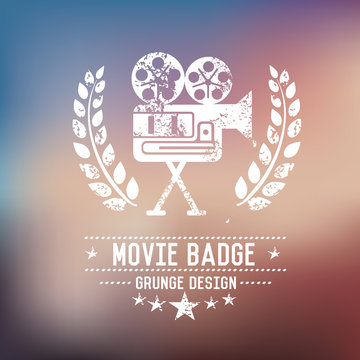 Movie badge grunge symbol on blur background