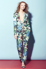 Teenage girl in high fashion flower suit.