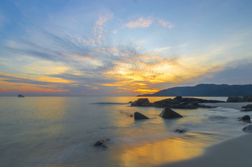 Fototapeta na wymiar Beach rock and sunrise background