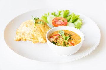 Delicious rice and red curry with pork and omelet (Thai panang c