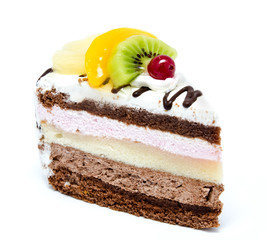 Piece of chocolate cake with icing and fresh fruit isolated