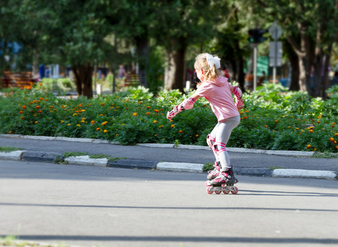 happy child girl roller skating
