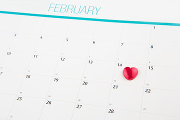 Red heart shape on Valentine's Day date on a calendar 