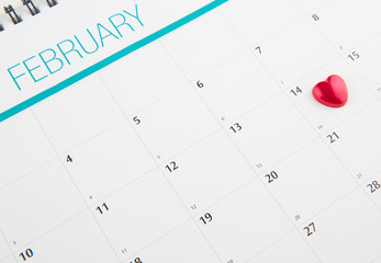 Red heart shape on Valentine's Day date on a calendar 