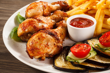 Grilled chicken legs with vegetables