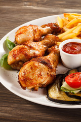 Grilled chicken legs with vegetables