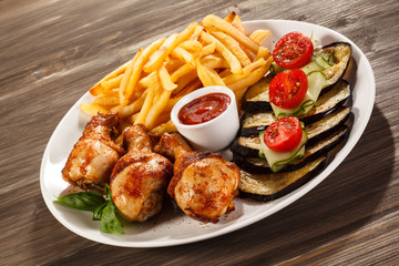 Grilled chicken legs with vegetables