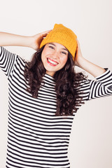 Happy autumn or winter girl with wool cap