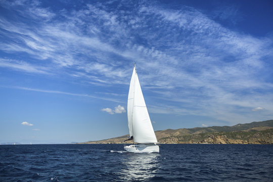 Sailing in the wind through the waves. Yachting. Luxury yachts.