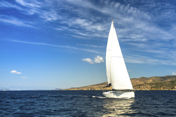 Fototapeta na wymiar Luxury yacht at Sailing regatta. Race in the Sea.